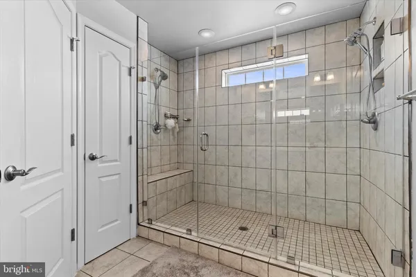 a bathroom with a shower and a sink