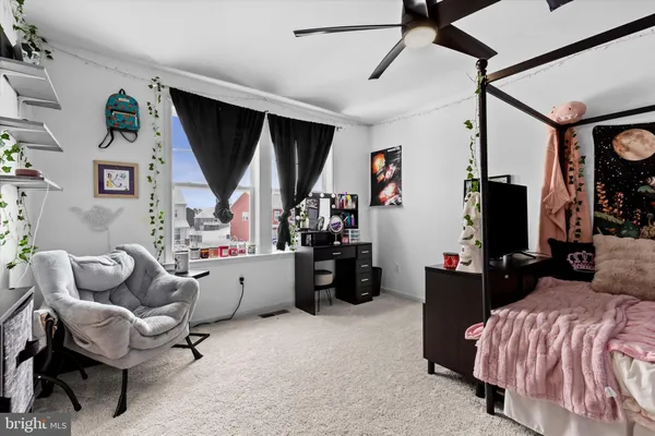 a bed room with furniture and a window