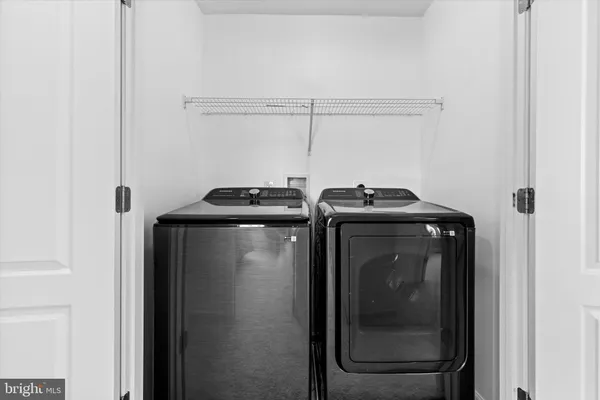 a utility room with washer and dryer