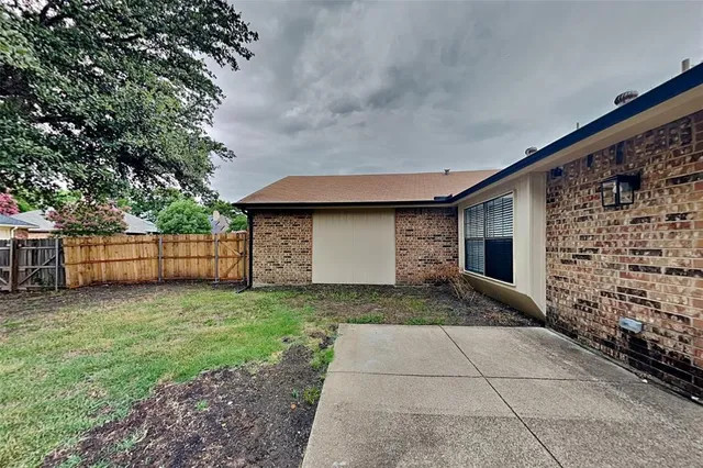 a view of a backyard of the house