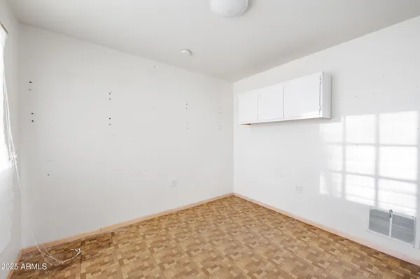 a view of a livingroom with furniture window and wooden floor
