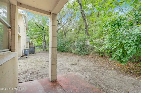 a backyard of a house with seating space
