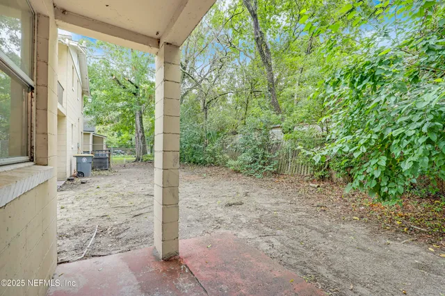 a backyard of a house with seating space