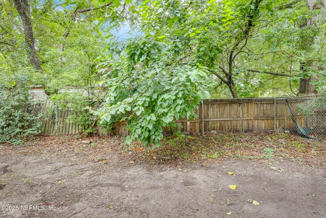 a view of a pathway along the house