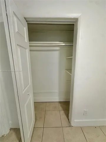 a bathroom with a glass door shower