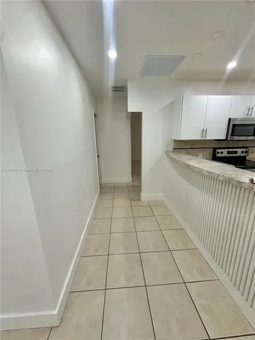 a view of a kitchen with a sink