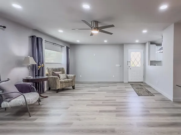 a living room with furniture and a large window