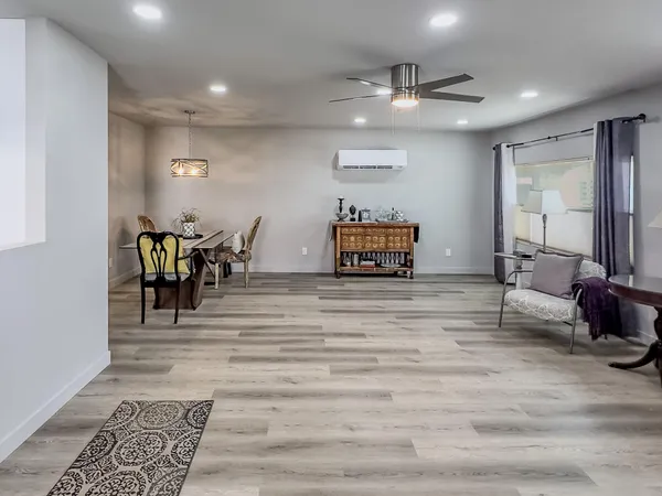 a large kitchen with stainless steel appliances granite countertop a stove and a sink
