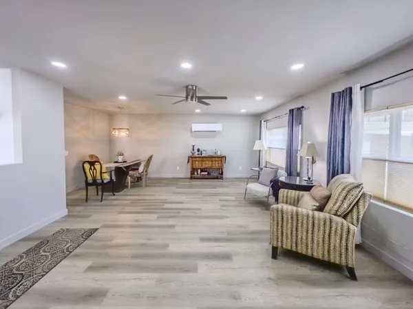 a view of a hallway with wooden cabinets