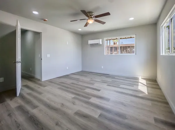 a view of hallway with wooden floor
