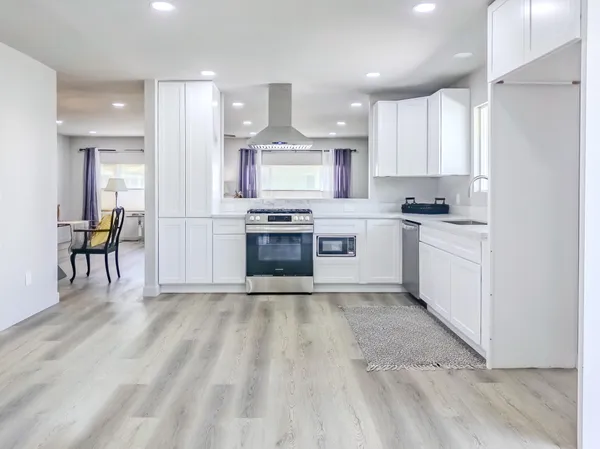 a view of a house with a flat screen tv