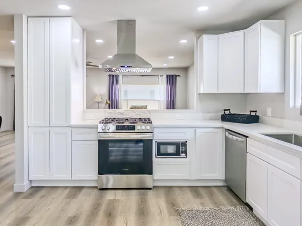 a view of a storage and utility room with washer and dryer