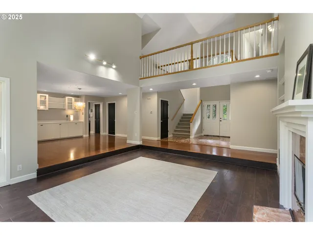 a view of an entryway with wooden floor