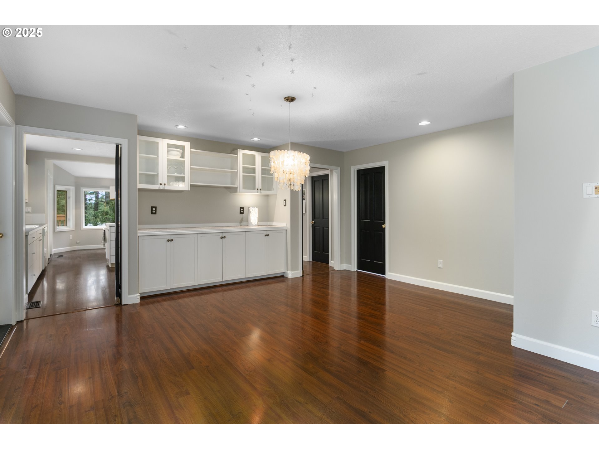 32370 Southeast Judd Road Eagle Creek, OR 97022 - Photo 12 of 48 a view of a kitchen and an empty room with wooden floor