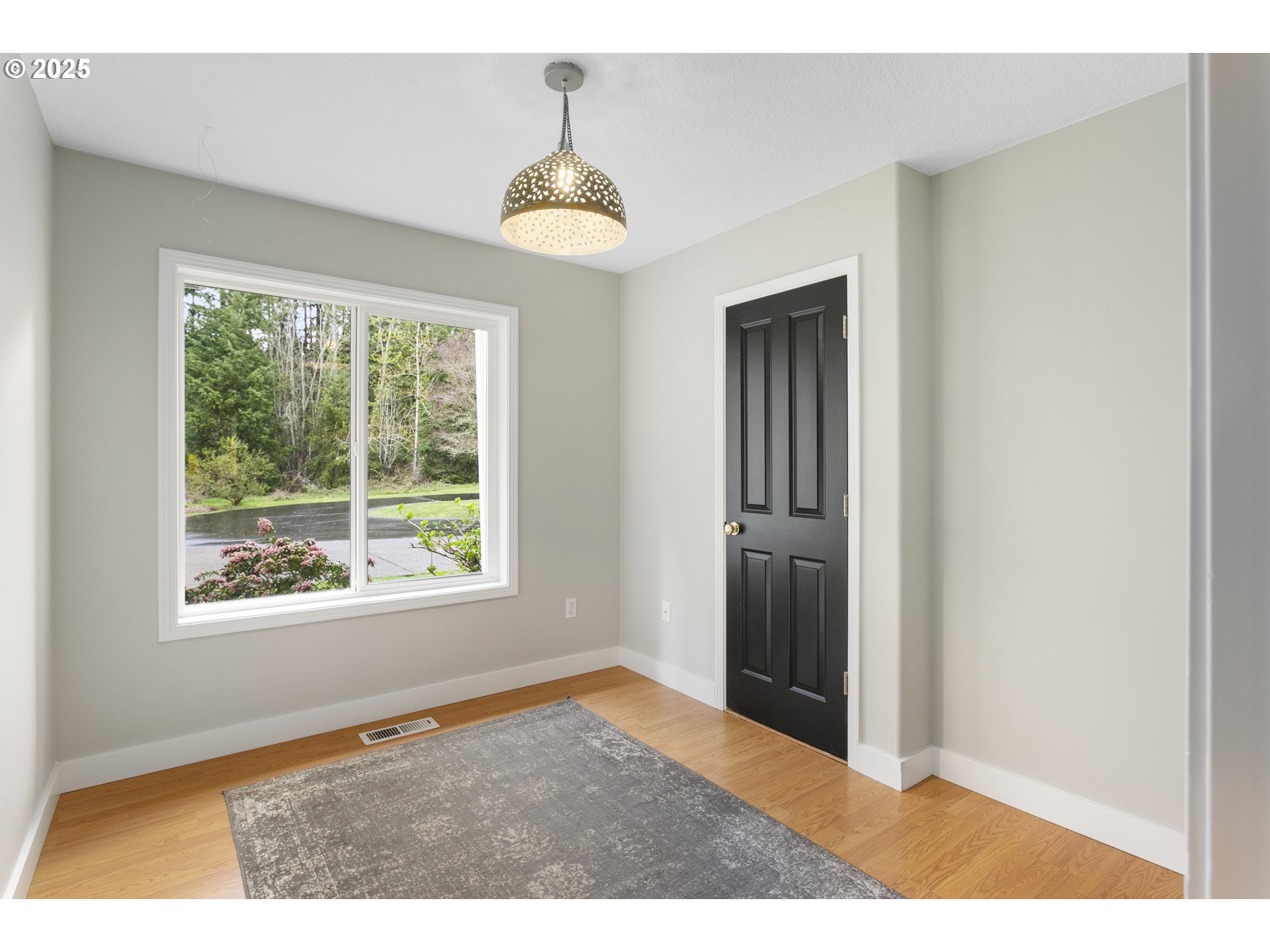 32370 Southeast Judd Road Eagle Creek, OR 97022 - Photo 14 of 48 a view of an empty room with window and wooden floor