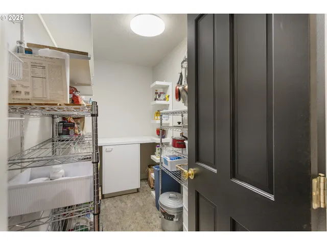 a kitchen with a refrigerator and a stove