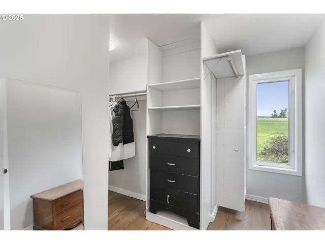 a room with a walk in closet and a window