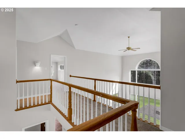 a view of a hallway with staircase