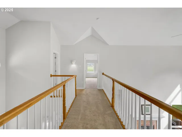 a view of a hallway with stairs