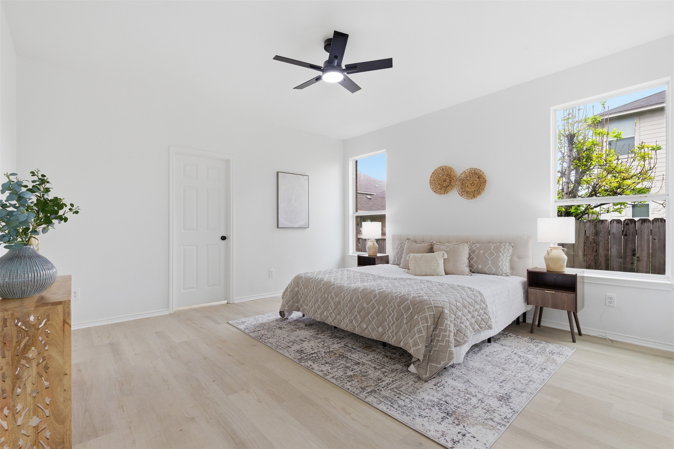 461 Hot Spring Valley Buda, TX 78610 - Photo 12 of 25 This room features light-colored flooring, white walls, and a ceiling fan