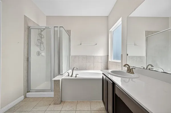 a bathroom with a sink double vanity and a mirror