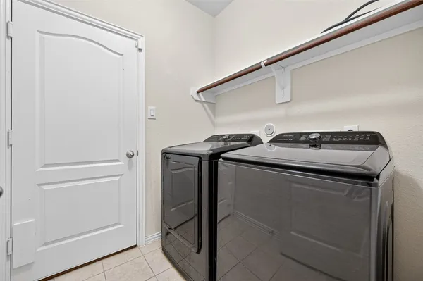a utility room with washer and dryer