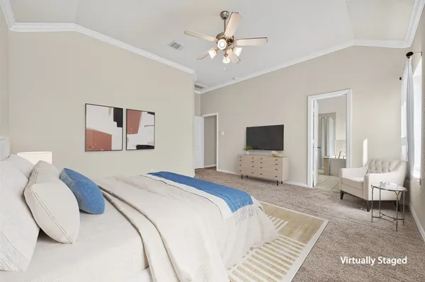 a bedroom with a bed and a couch