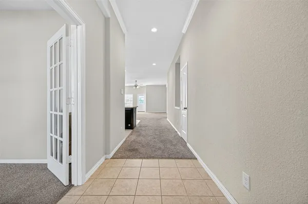 a view of a hallway with a white walls