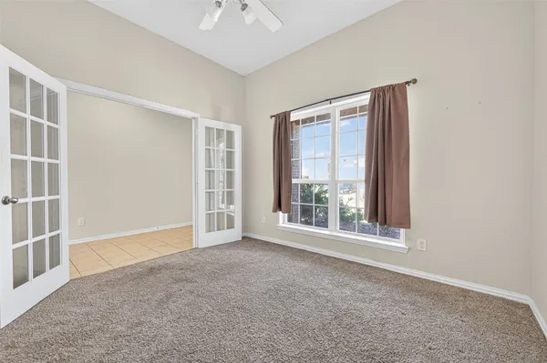 a view of an empty room with a window