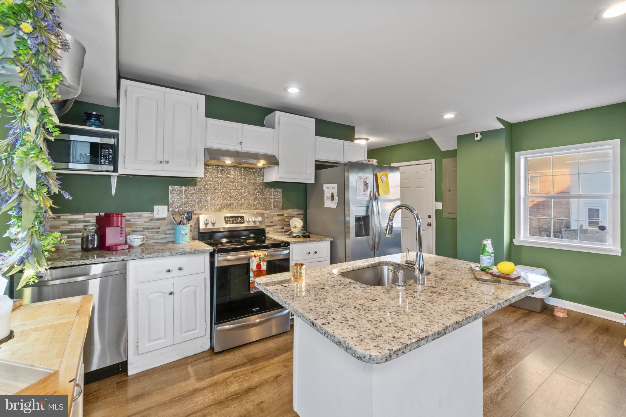 5904 Belle Grove Road Baltimore, MD 21225 - Photo 7 of 32 Kitchen featuring an island