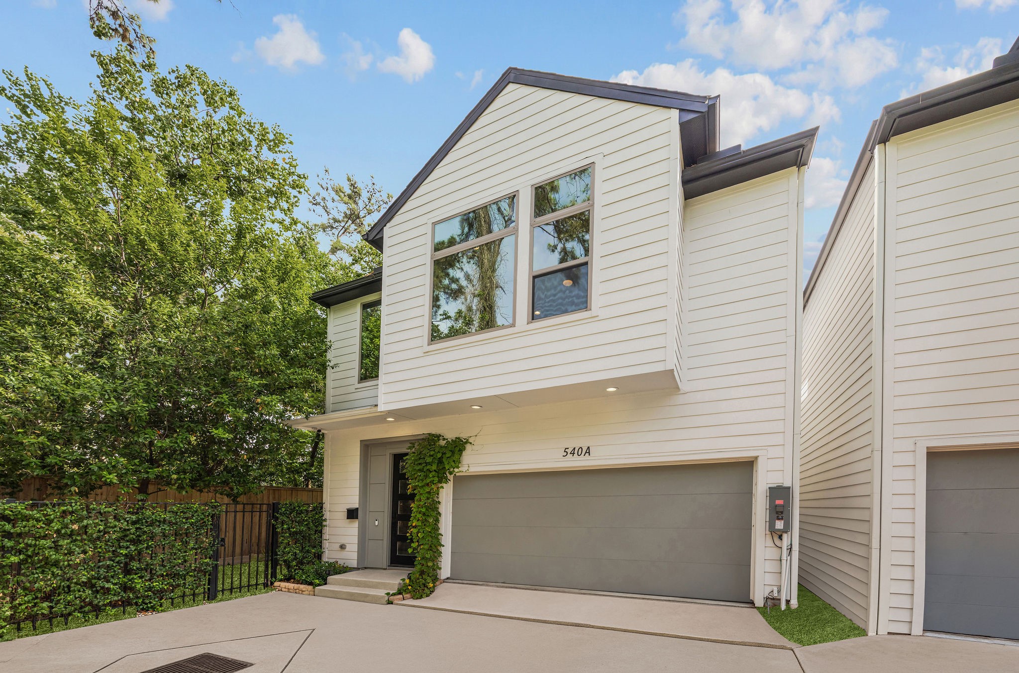 540 Janisch Road, Unit A Houston, TX 77018 - Photo 2 of 18 Additional exterior view highlighting the home’s modern design, private setting, and inviting entrance.