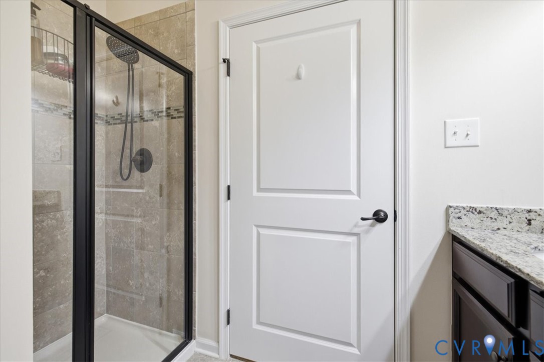 5716 Riverside Place Richmond, VA 23225 - Photo 29 of 33 Glass-enclosed shower with a matte black frame, la