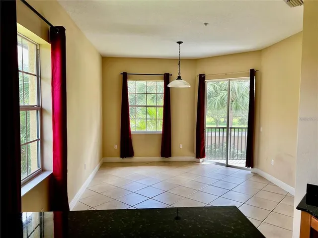 a view of a room with large windows