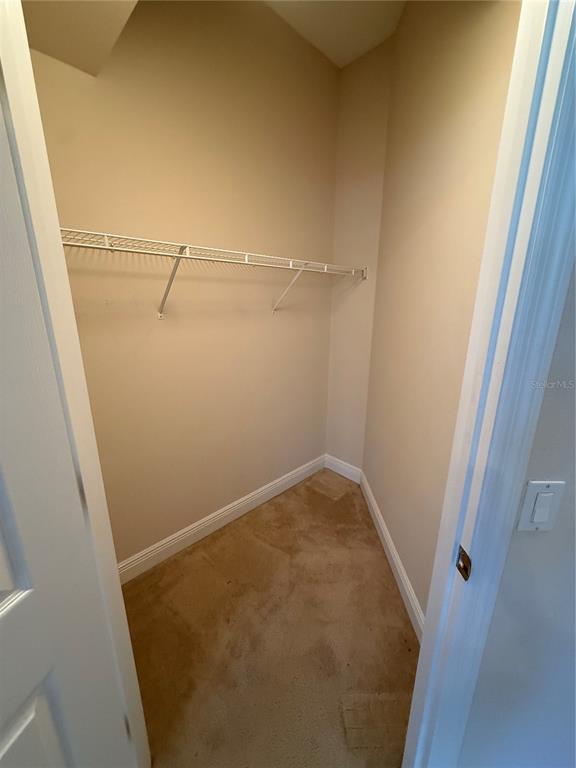 8153 Miramar Way Lakewood Ranch, FL 34202 - Photo 19 of 42 a view of a room with racks on the wall