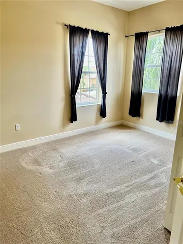 a view of an empty room with a fireplace