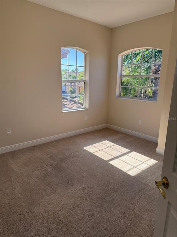 8153 Miramar Way Lakewood Ranch, FL 34202 - Photo 23 of 42 an empty room with a window