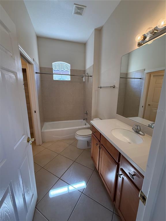 8153 Miramar Way Lakewood Ranch, FL 34202 - Photo 27 of 42 a bathroom with a sink a toilet a mirror and shower