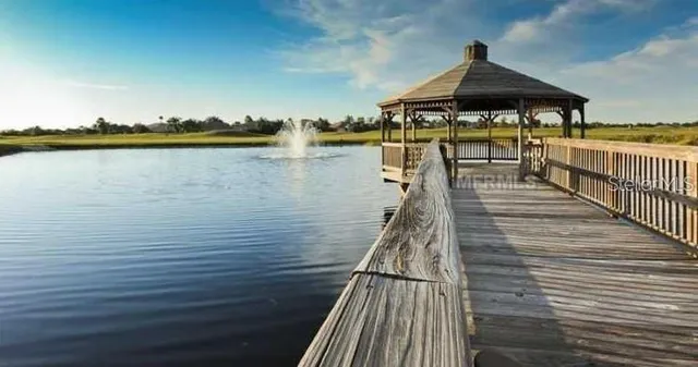 a view of a lake with sitting area