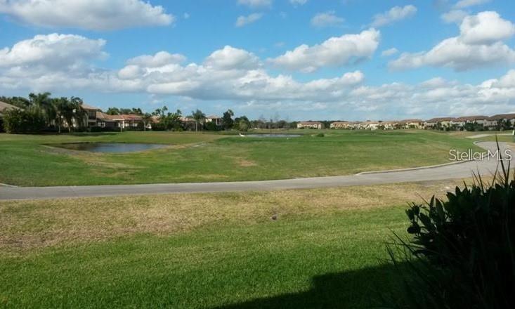 8153 Miramar Way Lakewood Ranch, FL 34202 - Photo 41 of 42 a view of a lake with houses in the back