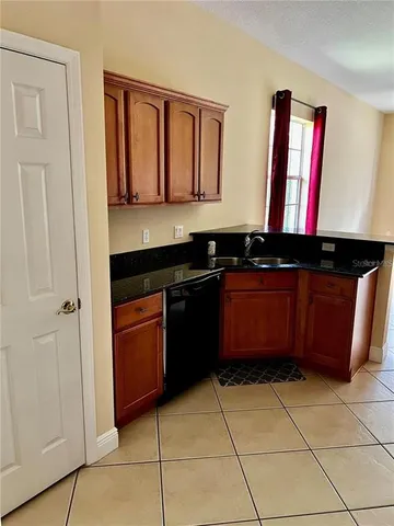 a kitchen with a sink and a stove
