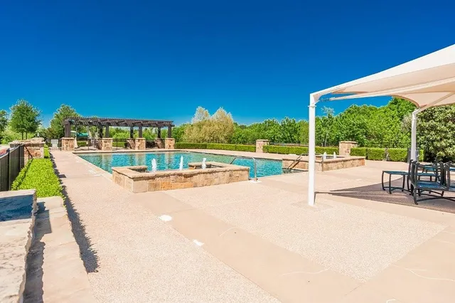 a view of swimming pool with a patio