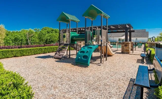 a view of a park with a slide