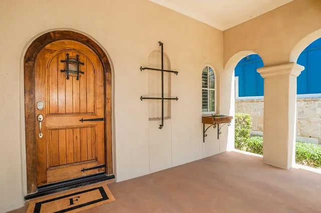 a view of front door with wooden floor