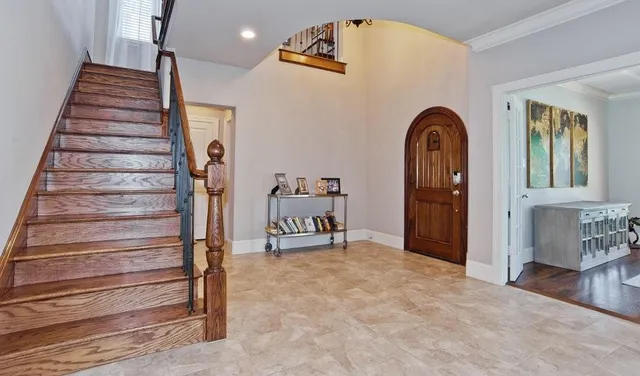 a view of entryway with workspace and stairs