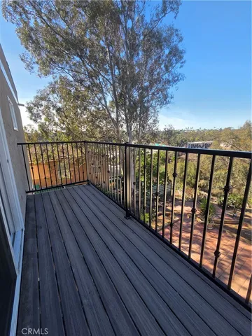 a view of balcony with wooden floor