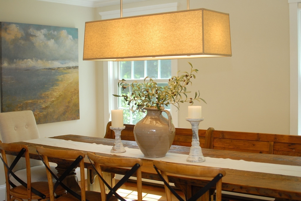 53 Sarah Way Concord, MA 01742 - Photo 16 of 42 a view of a dining room with furniture and wooden floor