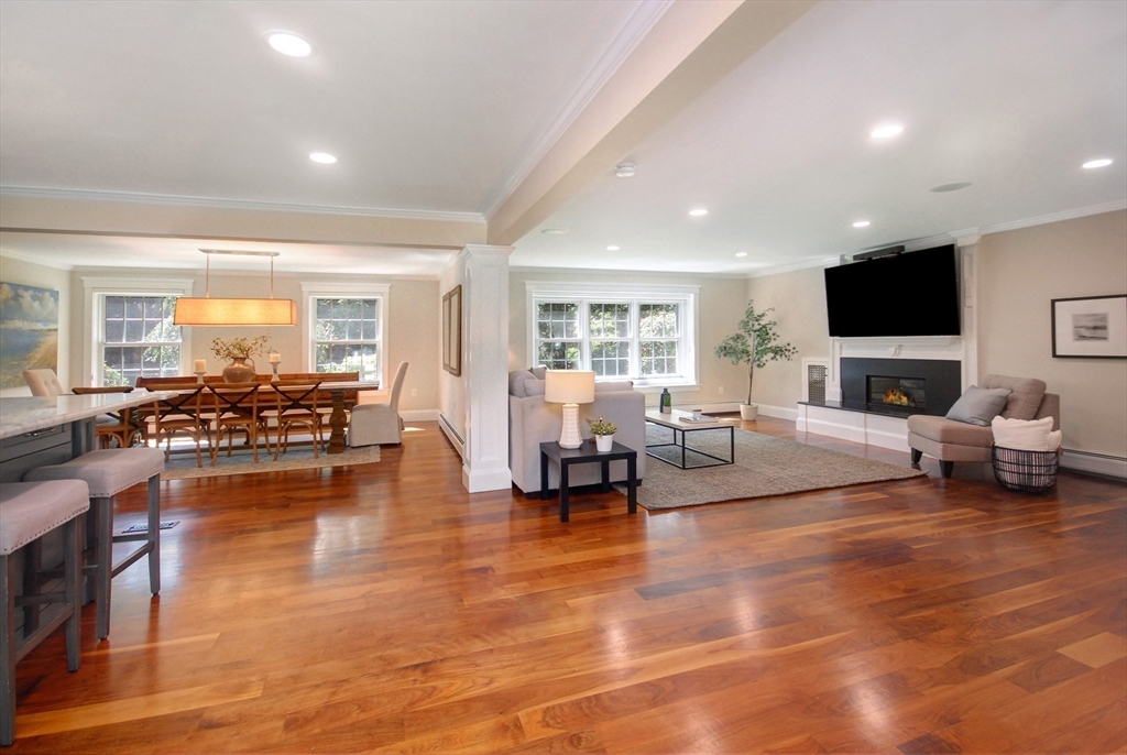 53 Sarah Way Concord, MA 01742 - Photo 17 of 42 a living room with furniture and a flat screen tv