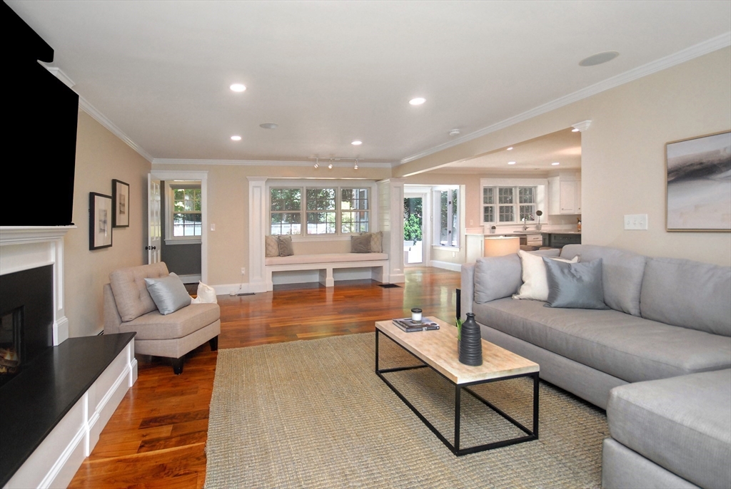 53 Sarah Way Concord, MA 01742 - Photo 19 of 42 a living room with fireplace furniture and a flat screen tv