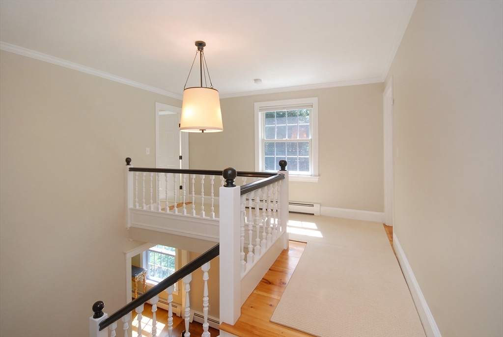 53 Sarah Way Concord, MA 01742 - Photo 20 of 42 a view of a hallway with windows