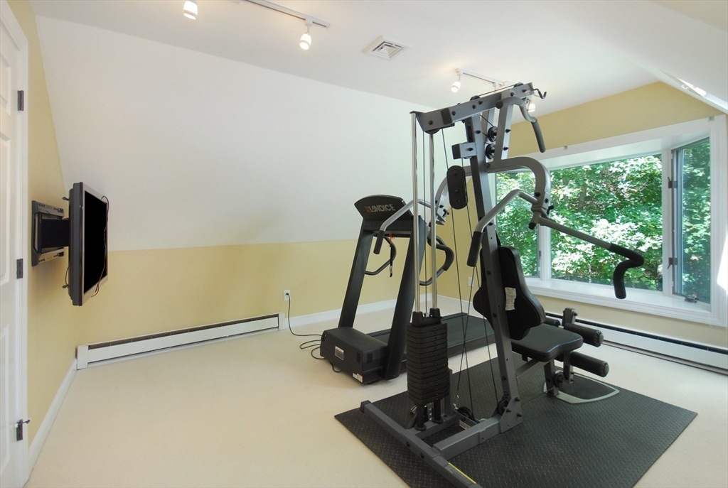 53 Sarah Way Concord, MA 01742 - Photo 23 of 42 a view of a room with gym equipment